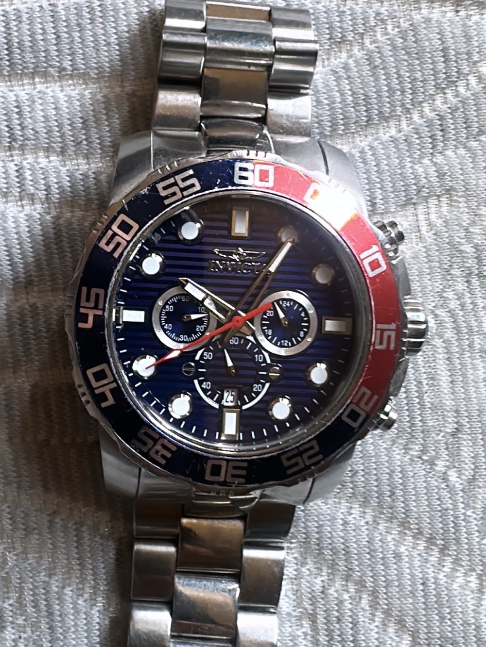 Invicta Silver Stainless Steel Watch with Blue Dial and Red-Blue Bezel